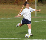 girl playing soccer