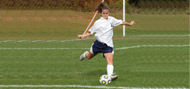 girl playing soccer